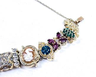 Richard Klein slide bracelet 14k yellow gold 33.39 dwt. Near mint condition. Set with Ruby, diamond, sapphire, emerald, amethyst, citrine, natural cameo, blue topaz, Opal, iolite, and rhodolite garnet.