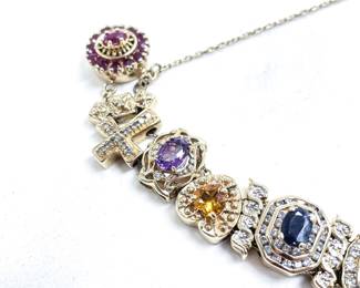 Richard Klein slide bracelet 14k yellow gold 33.39 dwt. Near mint condition. Set with Ruby, diamond, sapphire, emerald, amethyst, citrine, natural cameo, blue topaz, Opal, iolite, and rhodolite garnet.