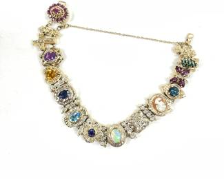 Richard Klein slide bracelet 14k yellow gold 33.39 dwt. Near mint condition. Set with Ruby, diamond, sapphire, emerald, amethyst, citrine, natural cameo, blue topaz, Opal, iolite, and rhodolite garnet.