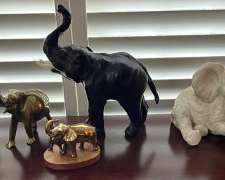 Many more elephants are scattered throughout 