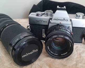 Minolta SRT 201 model 35 mm camera and zoom lens.