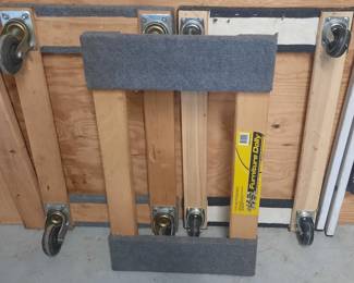 Three 4-wheeled floor movers