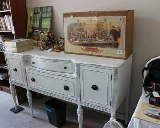 WHITE BUFFET WITH TWO NATIVITY SETS ON TOP