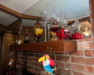 Miscellaneous glass items over fireplace