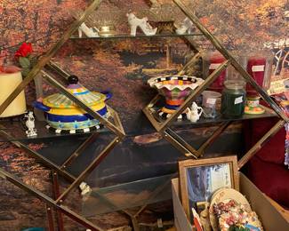 Triangle shelf unit filled with collectible decor, box of plates/pictures + doggie pillows