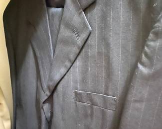 Nice selection of suits in master closet - apx 12 total - some are 3 pc with vest