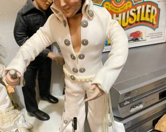 Front of Elvis doll on stand