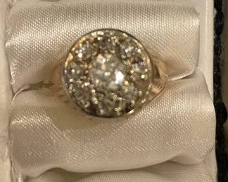 14 karat yellow gold cluster ring the ring size is 7.5 wt to approximate 8.03 g the center rank is larger and has an old European cut.