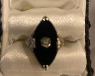 Woman’s 10 karat, white gold, black onyx and diamond accent ring, vintage