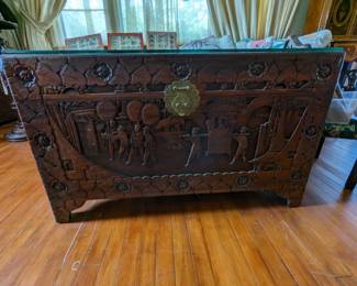 Camphor wood Chest.  Beautifully carved.  Glass top.