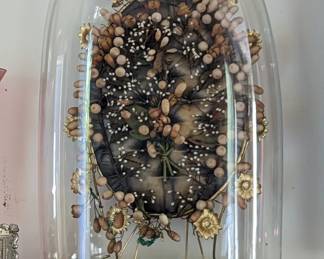 Antique 19th century French wax bridal crown on brass frame under dome.