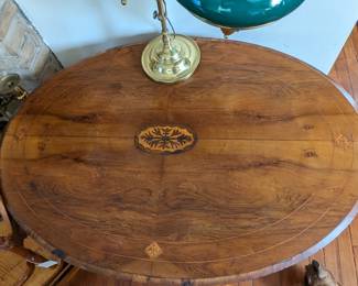 Top of marquetry tilt top table.