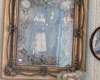 Shadow box of wedding picture surrounded by the brides veil.  