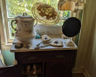 Victorian Walnut marble top washstand, antique hats, jeweled mirror and brush, antique shoes.