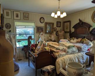 Large selection of vintage quilts, bedspreads, and decorator pillows.