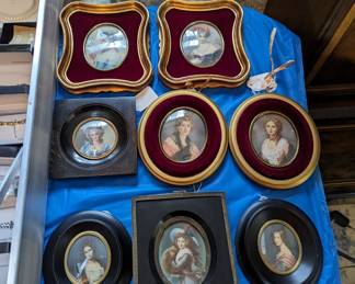 Miniature hand painted portraits.