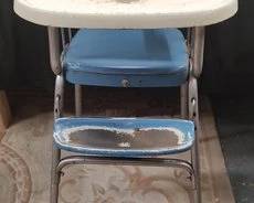 https://www.auctionninja.com/hewitt-estates-and-antiques/product/vintage-cosco-folding-metal-frame-high-chair-200241.html
