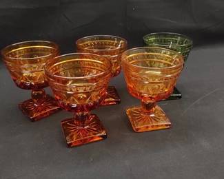 https://www.auctionninja.com/hewitt-estates-and-antiques/product/diana-glass-park-lane-green-amber-sherbet-glasses-200250.html