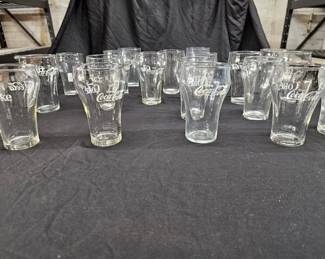 https://www.auctionninja.com/hewitt-estates-and-antiques/product/vintage-coca-cola-clear-glasses-white-logo-writing-design--300338.html