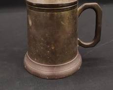 https://www.auctionninja.com/hewitt-estates-and-antiques/product/atco-solid-brass-stein-300296.html