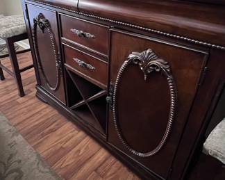 Dark wood buffet with wine storage rack