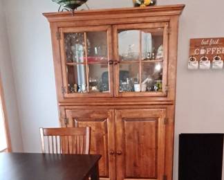 Stained Black Wood Dining Table with Four Wood Chairs and a Leather Covered Bench; Tall Wood China Cabinet with Glass Doors and Wood Doors; Assorted Decorative Items as well!!