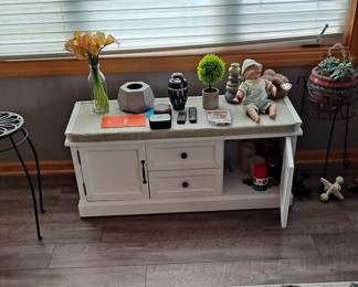 White Bench and/or Coffee Table with Drawers & Doors; Metal Plant Stands; Area Rugs; and large assortment of small decorative items.