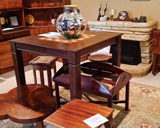 Pub Table with Chess / Checkboard on Top and a Storage Drawer for Game Pieces; Assorted Side Tables in Different Woods, Styles and Shapes; Large Jar with Matchbook Collection; Large Oriental Style Rug; Faux Electric Fireplace; Mantle Clock and much more!!