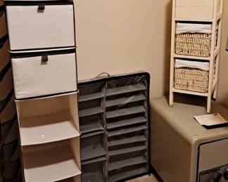 Hanging Storage; Underbead Shoe Storage; Large Safe with Combination; Wood Cabinet with 2 Wicker Basket Drawers lined in cloth.