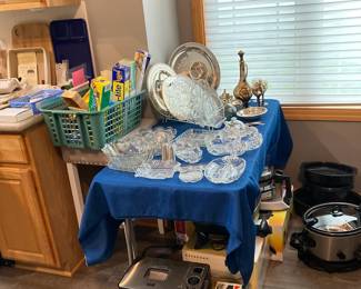 Assorted Cookware:  KitchenAid Grinder; Crock Pots in Varying Sizes; Elegant Glassware Serving Dishes; Bread Machine and much more!