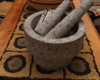 Giant stone mortar and two pestles