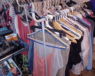 Huge assortment of Woman's designer clothe. Some clothing still has tags on them. This is only a portion or what's available. 