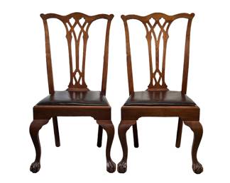 (2PC) PAIR CHIPPENDALE STYLE MAHOGANY DINING CHAIRS | Carved back dining chair with mahogany leather seat cushion and claw and ball foot front legs. - l. 22 x w. 20.5 x h. 40 in