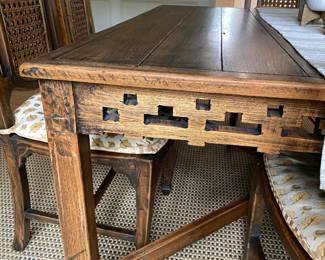 The rug under the table is 10' by 11'.