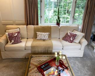 couch comes in two parts and is 105" in overall length.  There is a curved piece that comes with it.