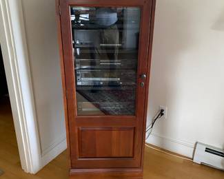 Cabinet is 56" tall, 23" wide, 24" deep, Cherry