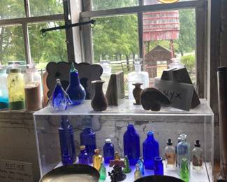 12. Large selection of bottles and scales.