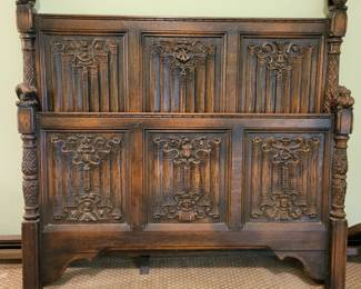 A heavily carved antique single bed with Lions, Dragons and Snake carvings, 