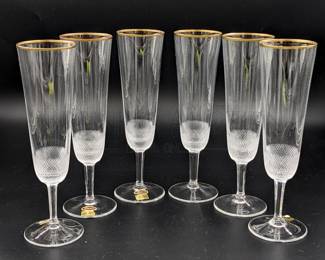 (X6) MOSER CRYSTAL CHAMPAGNE FLUTES, GOLD RIMMED
W/ CERTIFICATE OF GUARANTEE & ORIGINAL BOX
ETCHED ON BOTTOM

"MOSER GLASSWORKS IS EXCLUSIVELY MOUTH-BLOWN AND HAND-CRAFTED FOLLOWING AN OLD ARTISTIC TRADITION"
