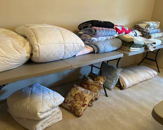 Linens including down comforters