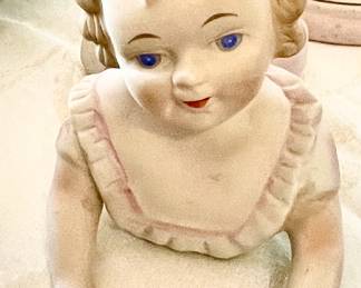 Vintage laying little girl Piano baby