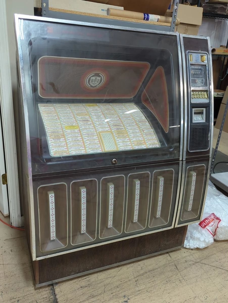 Rowe International Inc Phonograph Model R-82, Coin And Bill Operated, Includes 100 Records of Various Artists And Genres, Powers On, With Manual, 42"x26"x56"