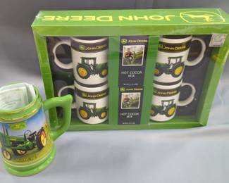 John Deere Hot Cocoa Set Including 4 John Deere Tractor Mugs And 2 Boxes Of Hot Cocoa Mix, And John Deere Model B Stein With COA