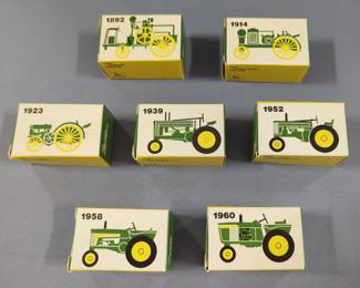 Ertl Diecast John Deere Lawn & Garden Tractor, Dumpcart, And Seven Tractor Collector Set Includes 1892-1960