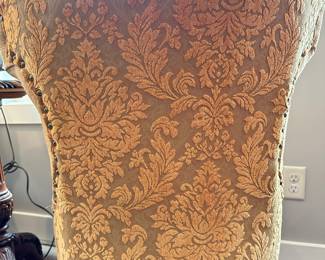 Back of oatmeal colored chairs