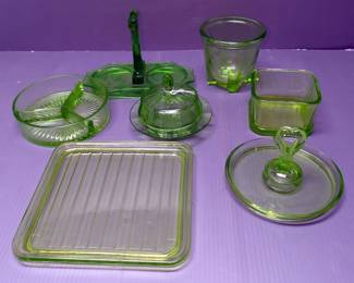 Vintage Vaseline Glass Assortment Including Lidded Candy Dish, Divided Dish, Measuring Bowl, Tray, And More