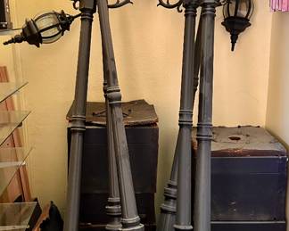 Black three light outdoor lamp posts.  There are six available.