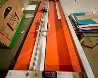 Picture framing equipment and matting boards.  The mat cutter shown is an Art Mate C-52.
