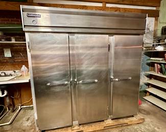 Working stainless steel commercial refrigerator: doors closed