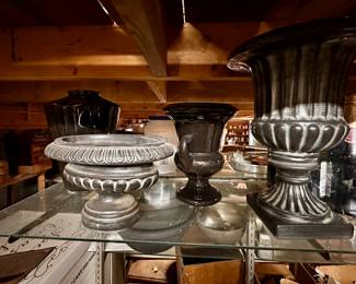 Decorative urns.  Note that the glass shelves and brackets are also for sale.